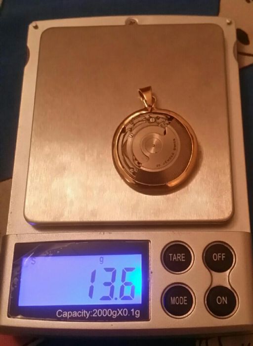 Pendente em ouro 18kt,c/ máquina swiss nade,peso total ,13.6 gr,único