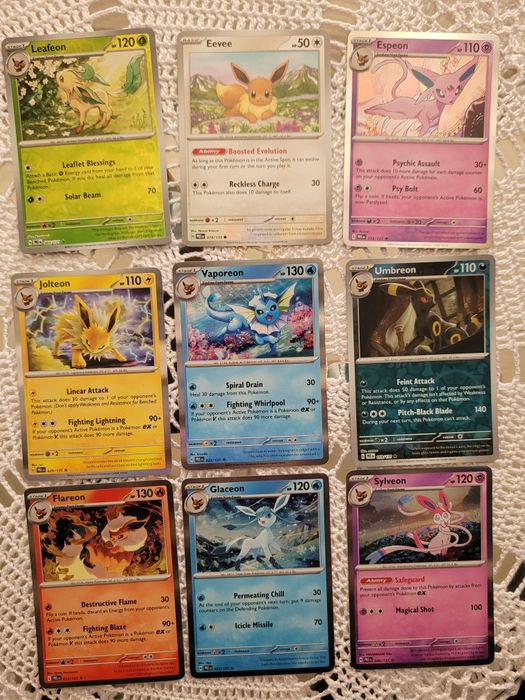 Karty Pokemon Eevee ewolucje. Umbreon Sylveon. Świecące.  Oryginalne