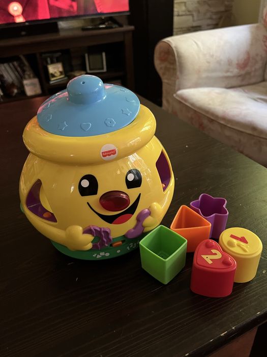 Garnuszek na klocuszek Fisher Price