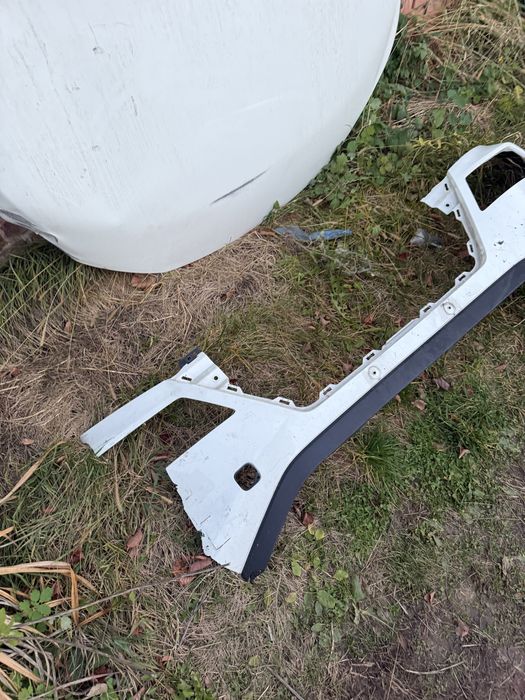 Передний бампер Nissan Rogue T33 дорест левая часть