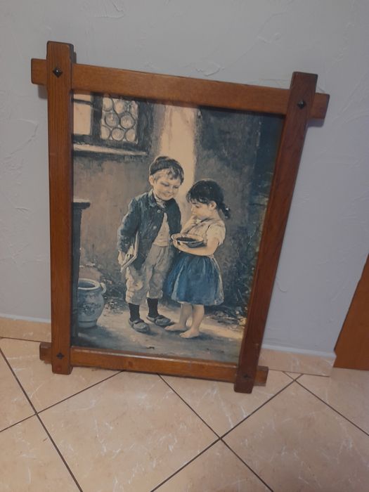 Sprzedam obraz w drewnianej ramię.