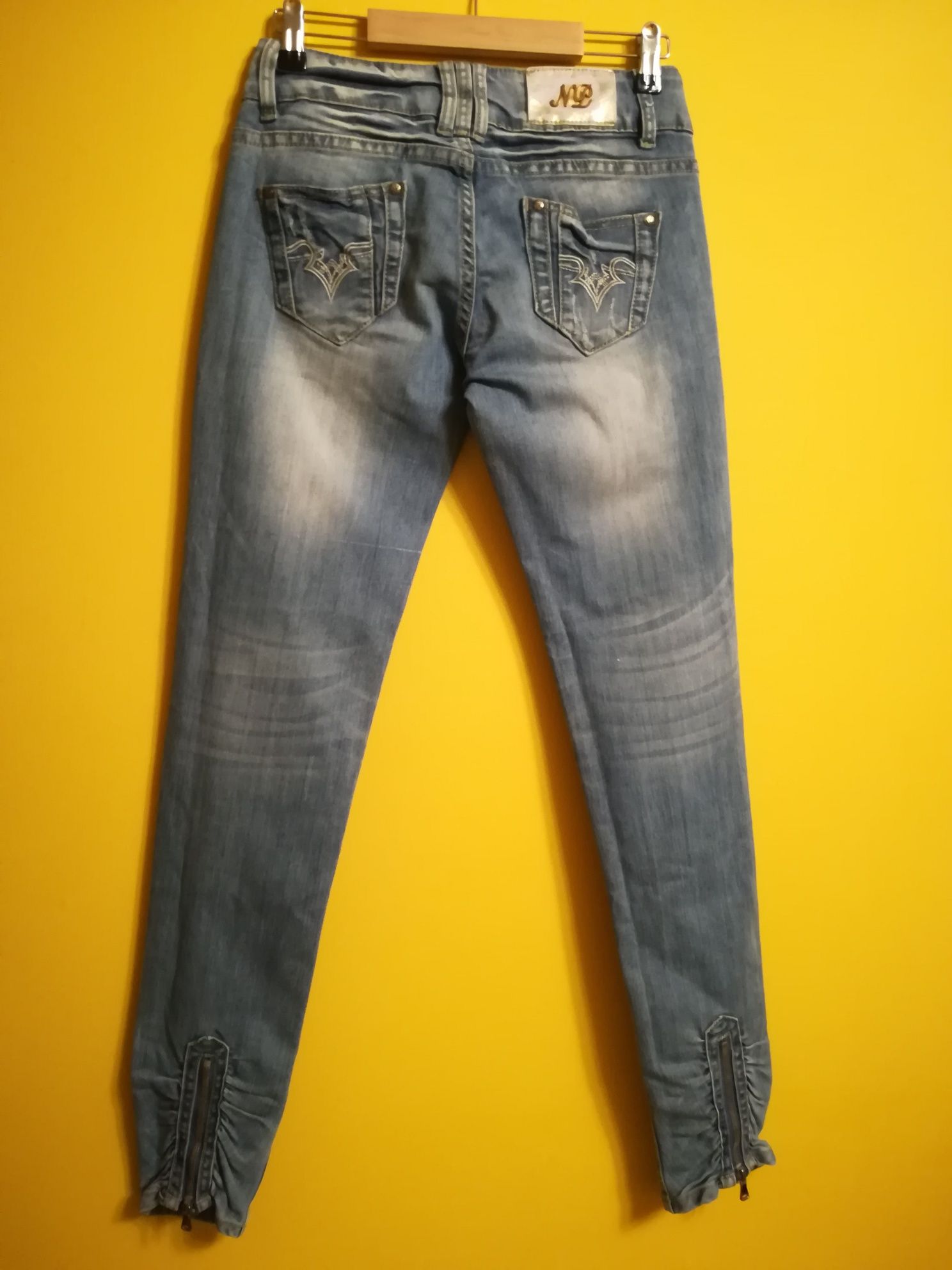 Spodnie damskie XS 26/36 NEWPLAY JEANS niebieskie z przetarciami