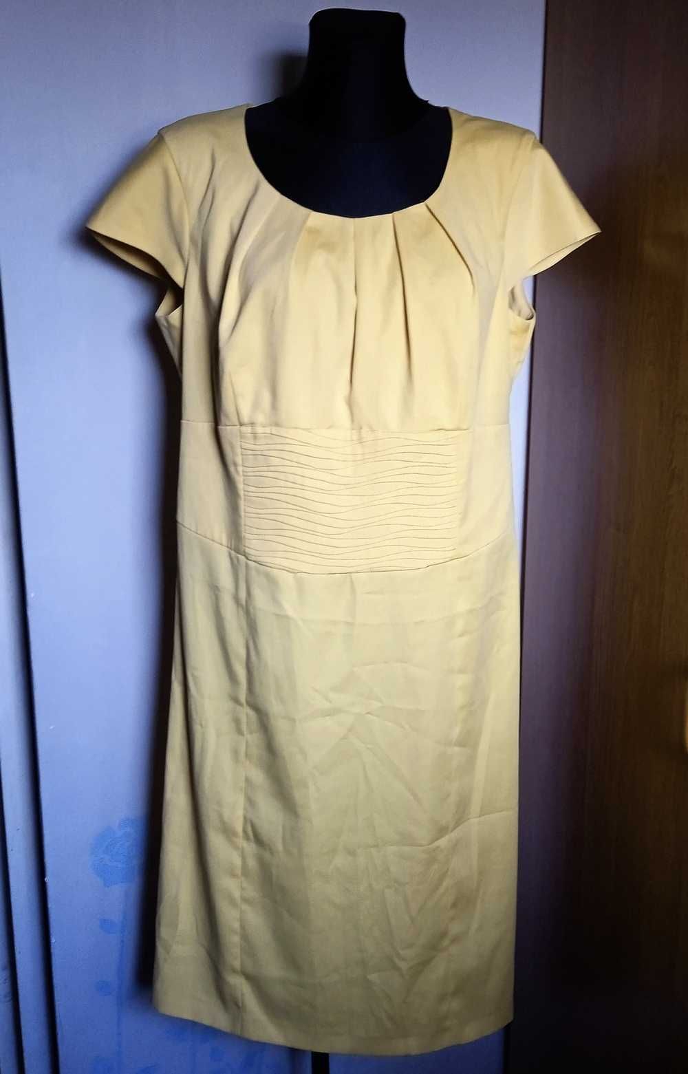 Elegancka żółta sukienka r. 46