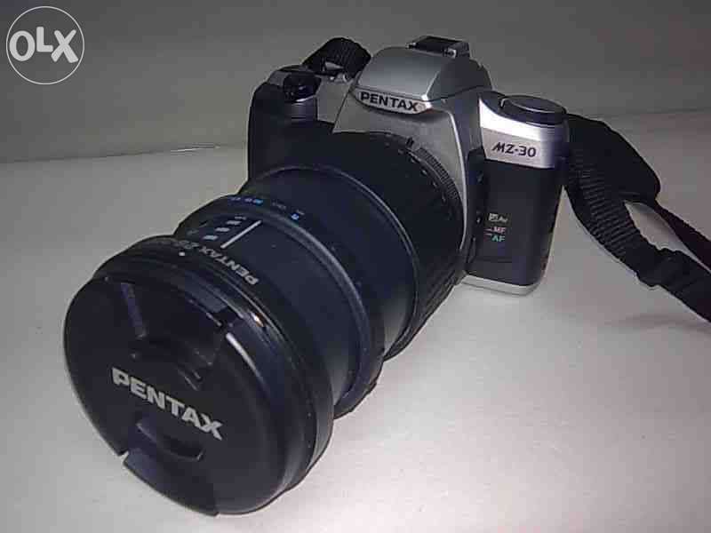 Máquina fotográfica Pentax + objectiva