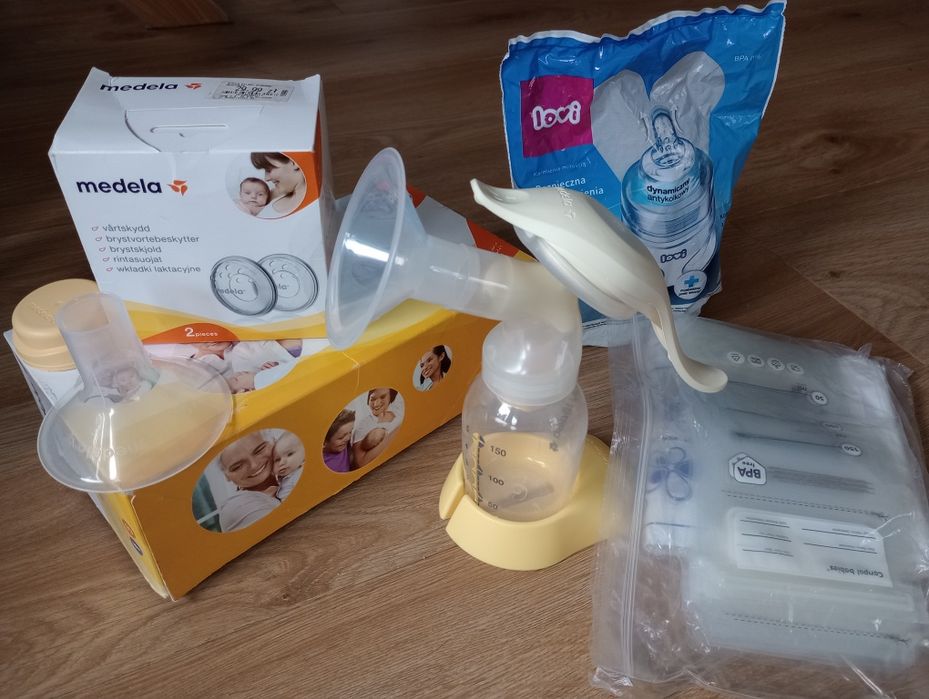Medela laktator ręczny, wkładki latacyjne, woreczki + butelka