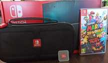 Nintendo Switch (ciemnoszary) + pokrowiec + gra + karta pamięci 128GB