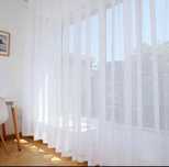 Cortinas brancas novas