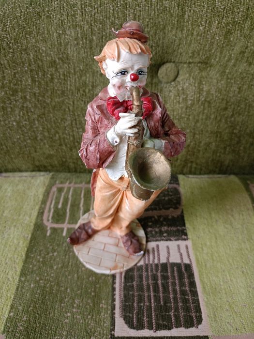 Grający klaun porcelanowy