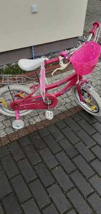 rowerek rozowy dla dziweczynki z kolkami bocznnymi do nauki jazdy
