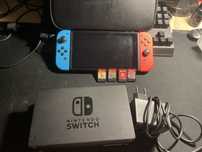 Nitendo swich, jogos, carregador, a bolça e a caixa de transporte
