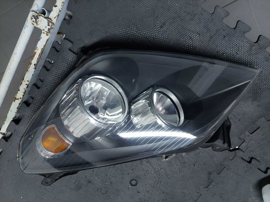 farol esq Opel Astra h