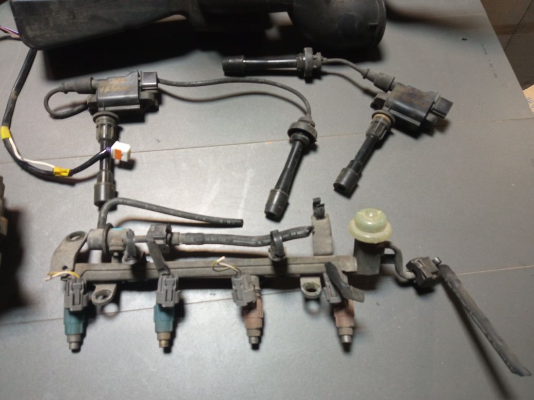 Mazda Premacy 1.8 alternator chłodnica lampy cewka roleta kierunki