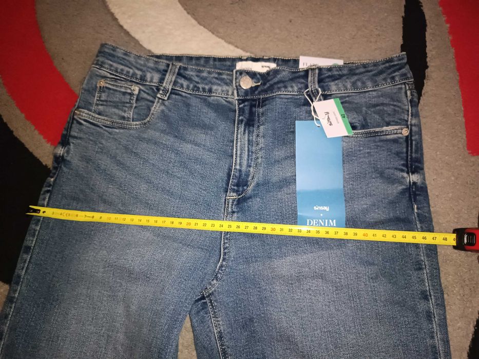 Nowe jeansy dzwony mid waist 42