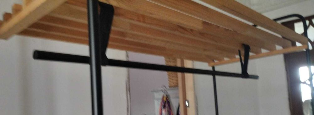 Wood and metal clothes hanging rail