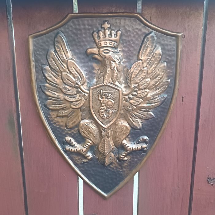 Orzeł z Syrenką z mosiądzu