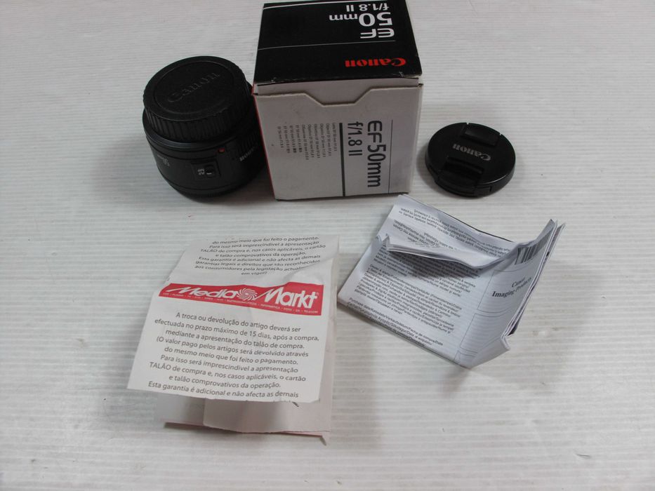 Canon  50mm 1.8 II ou STM, ou ainda a 24mm 2.8-Ver descrição