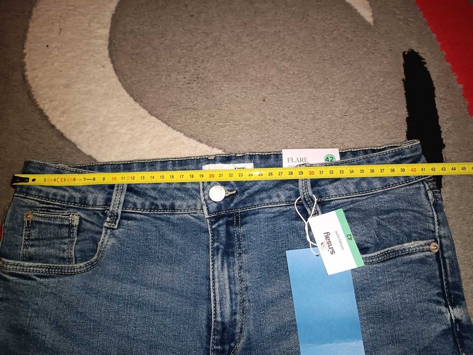 Nowe jeansy dzwony mid waist 42