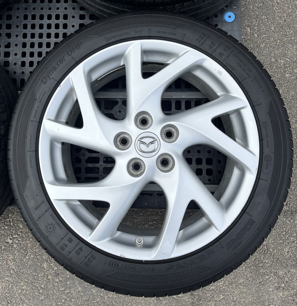 Komplet kół 18” Mazda – felgi aluminiowe + prawie nowe opony Kleber