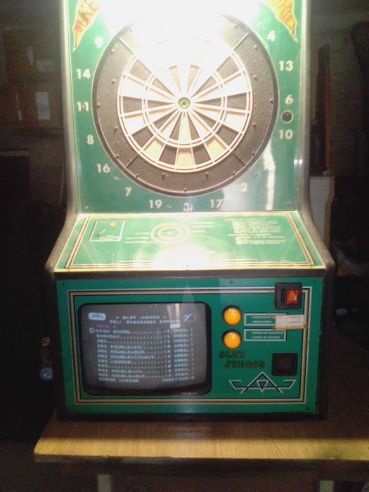 Máquina de setas acionada por moeda usada, Dardomania