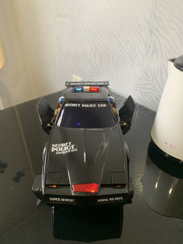 Игрушка полицейская машина.