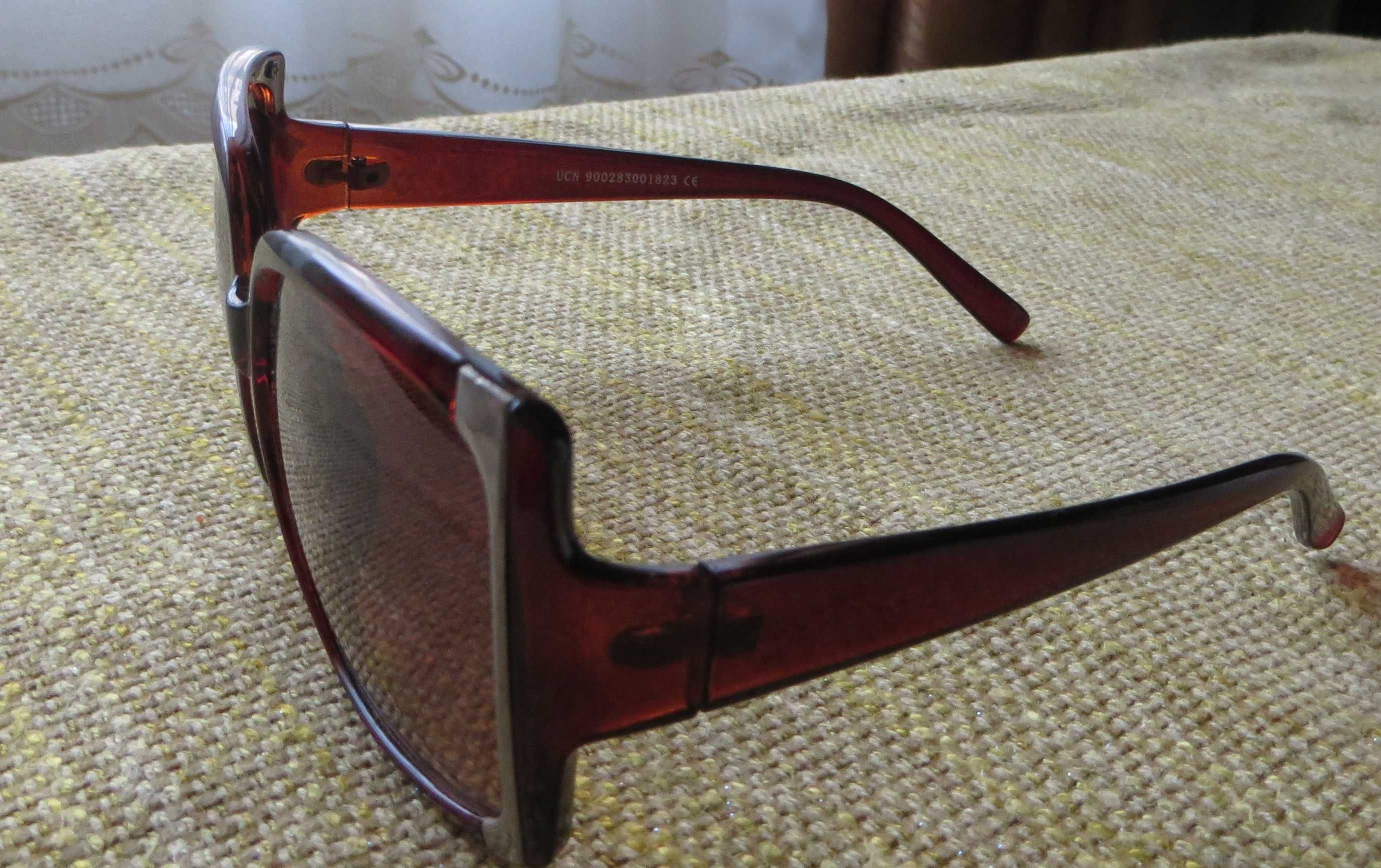 Óculos Sol, massa, lentes castanhos, anti reflexo - Ótica Santana