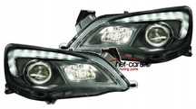 Reflektory lampy przednie przód OPEL ASTRA J LED DAYLINE H7 H1