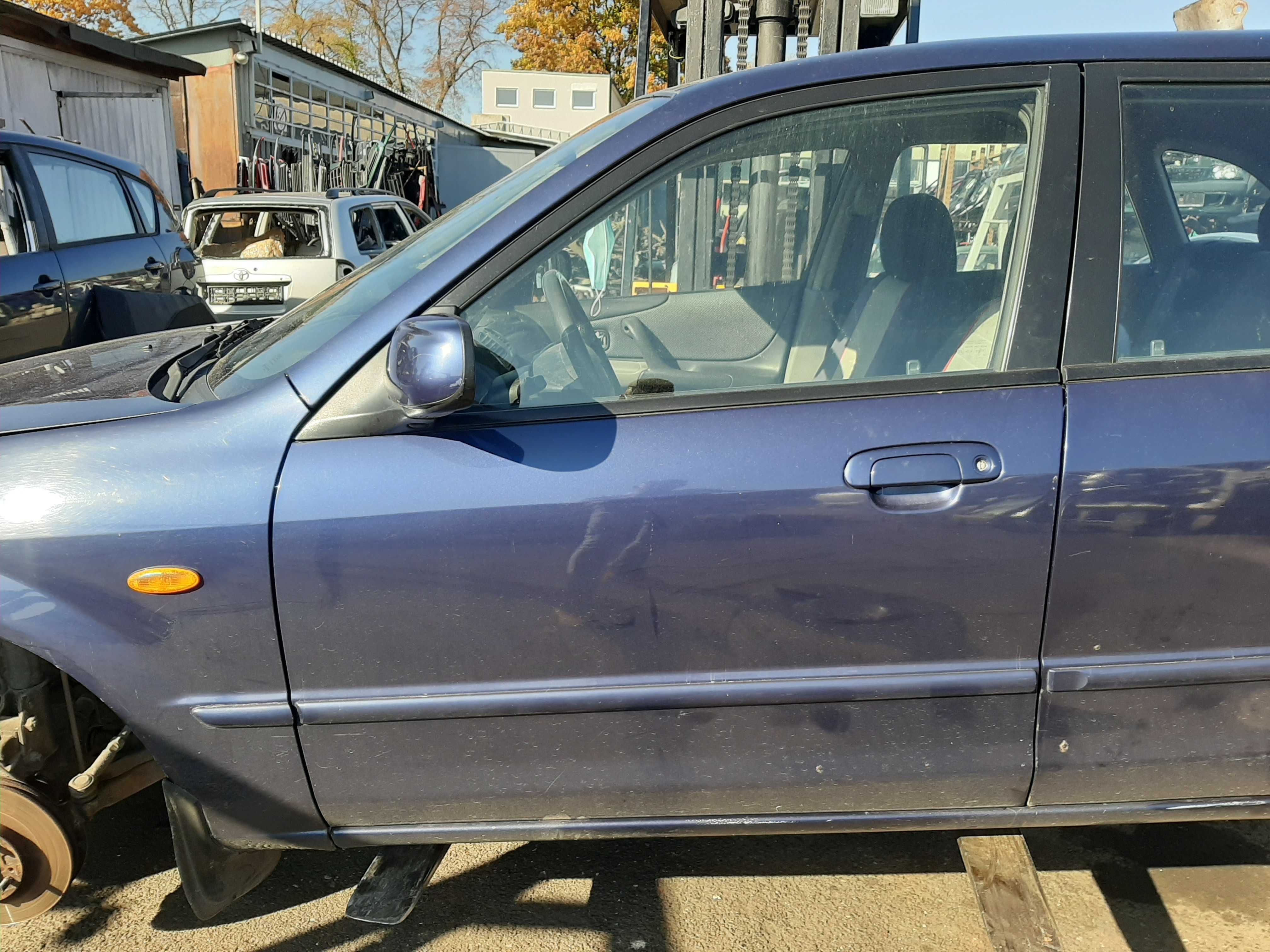 Mazda 323BJ 5D 2.0TD  2003r.Drzwi przednie lewe