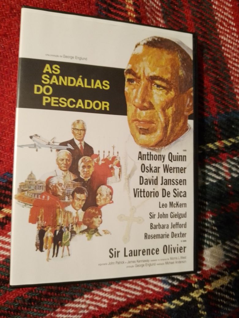 As sandálias do Pescador-C/A.Quinn-L.Olivier-10E-O Barbeiro3E Desde 3E