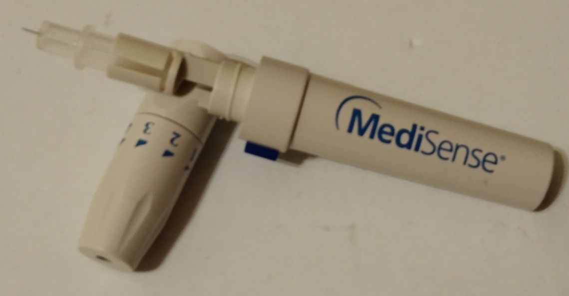 Zestaw NOWY nakłuwacz MEDISENSE firmy ABBOTT z lancetami 50 szt + 50