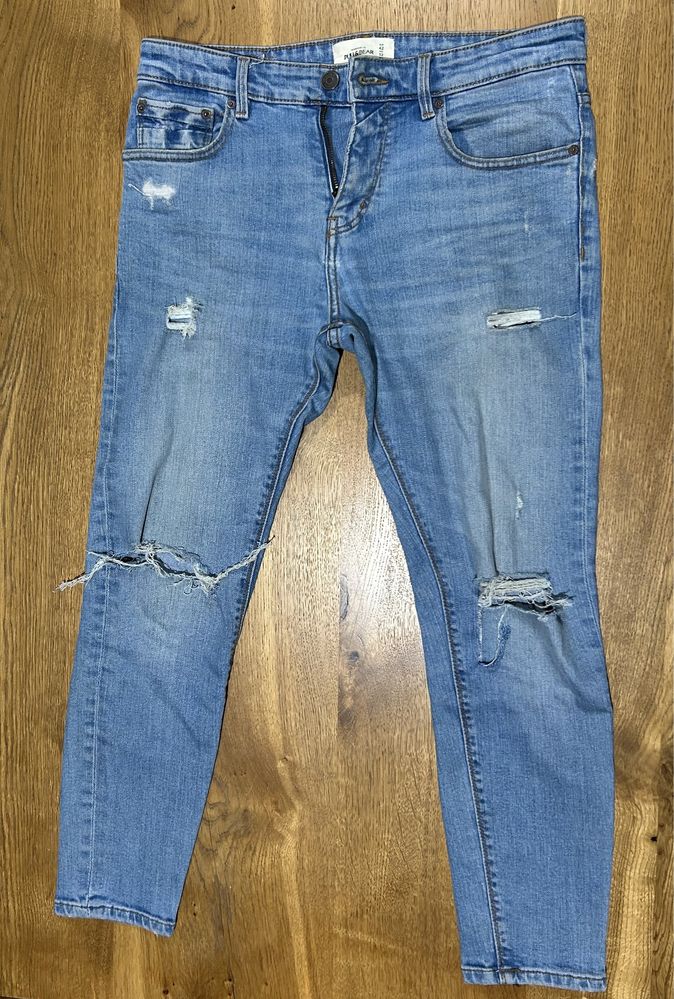 Spodnie jasne jeansy z przetarciami super skinny Pull&Bear rozmiar 42