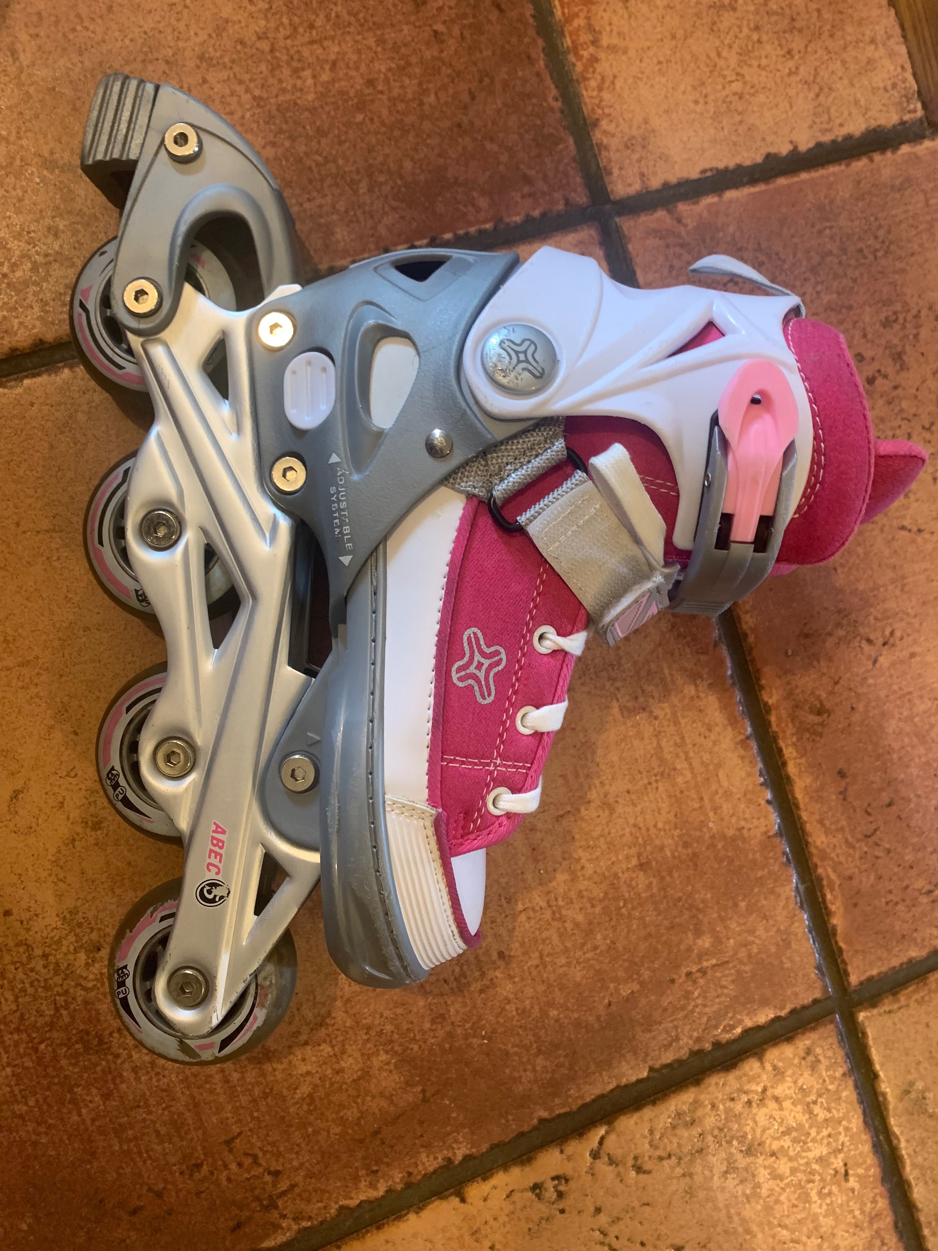 Patins em linha rosa