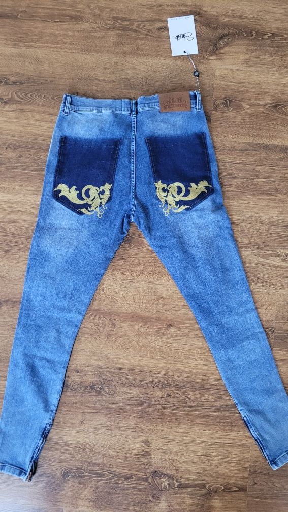 Spodnie damskie jeansowe z dziurami SikSilk M