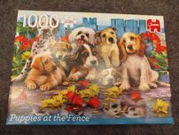Puzzle Jumbo 1000 Puppies at the Fance