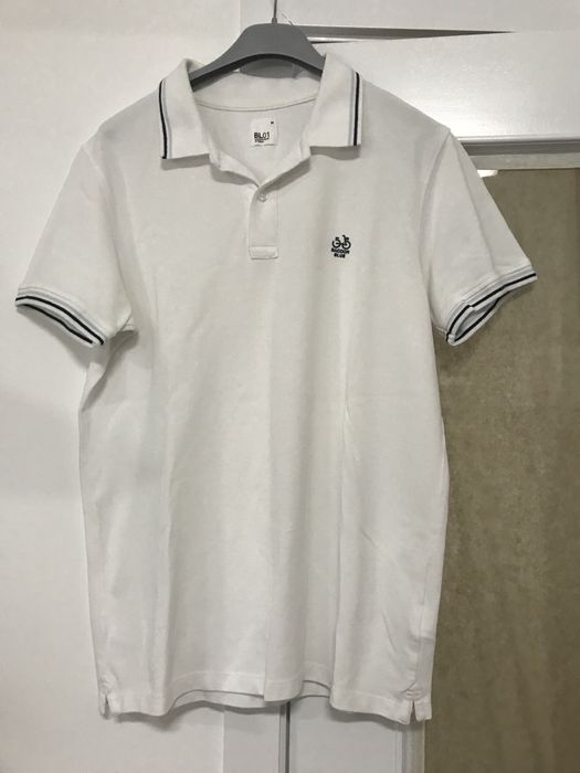 Polo branco, marca Saccor