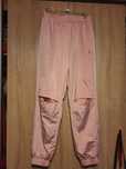 Juicy couture dresy spodnie śliskie ortalion dziury na kolanach odblas