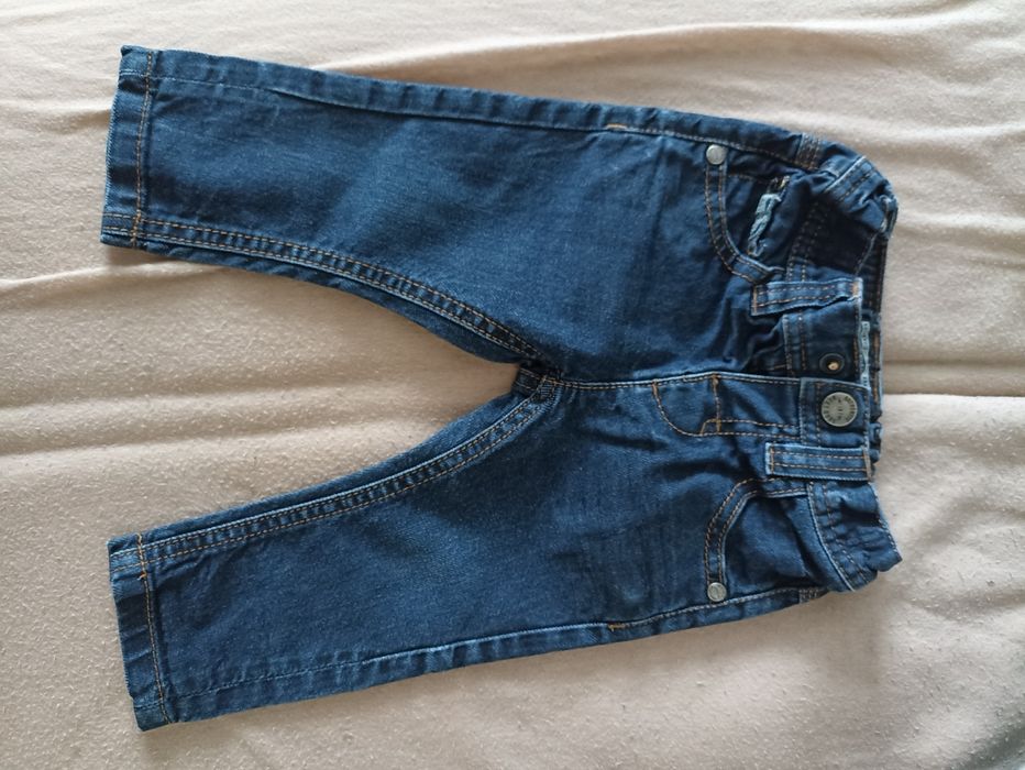 Spodnie 6-9 miesięcy next jeansy