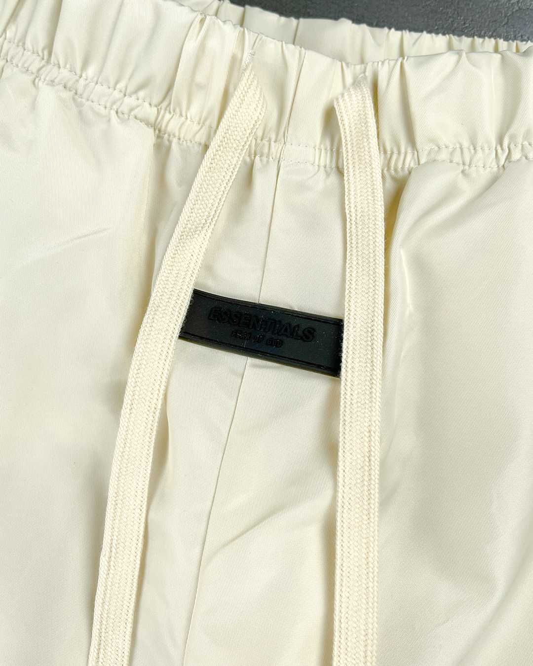 Штани Fear Of God Essentials Nylon Track Pants With Logo Cream