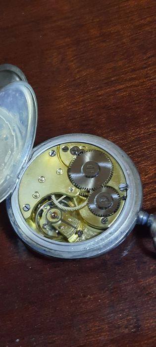 Relógio de bolso antigo Omega em prata 15 rubis