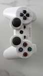 Pad do PS3 biały