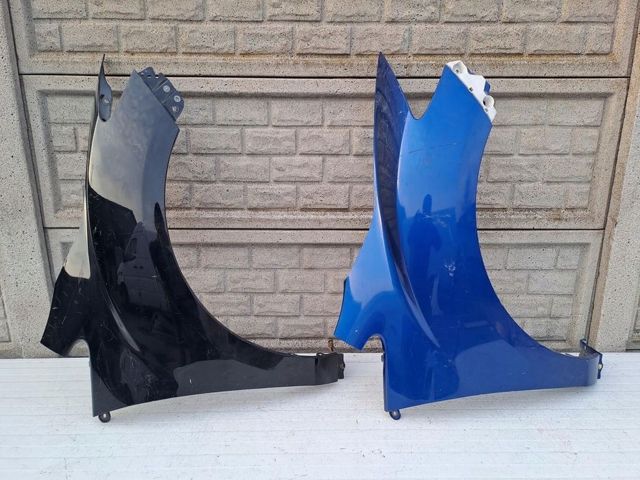 MAZDA CX-7 CX7 BŁOTNIK PRAWY PRZEDNI