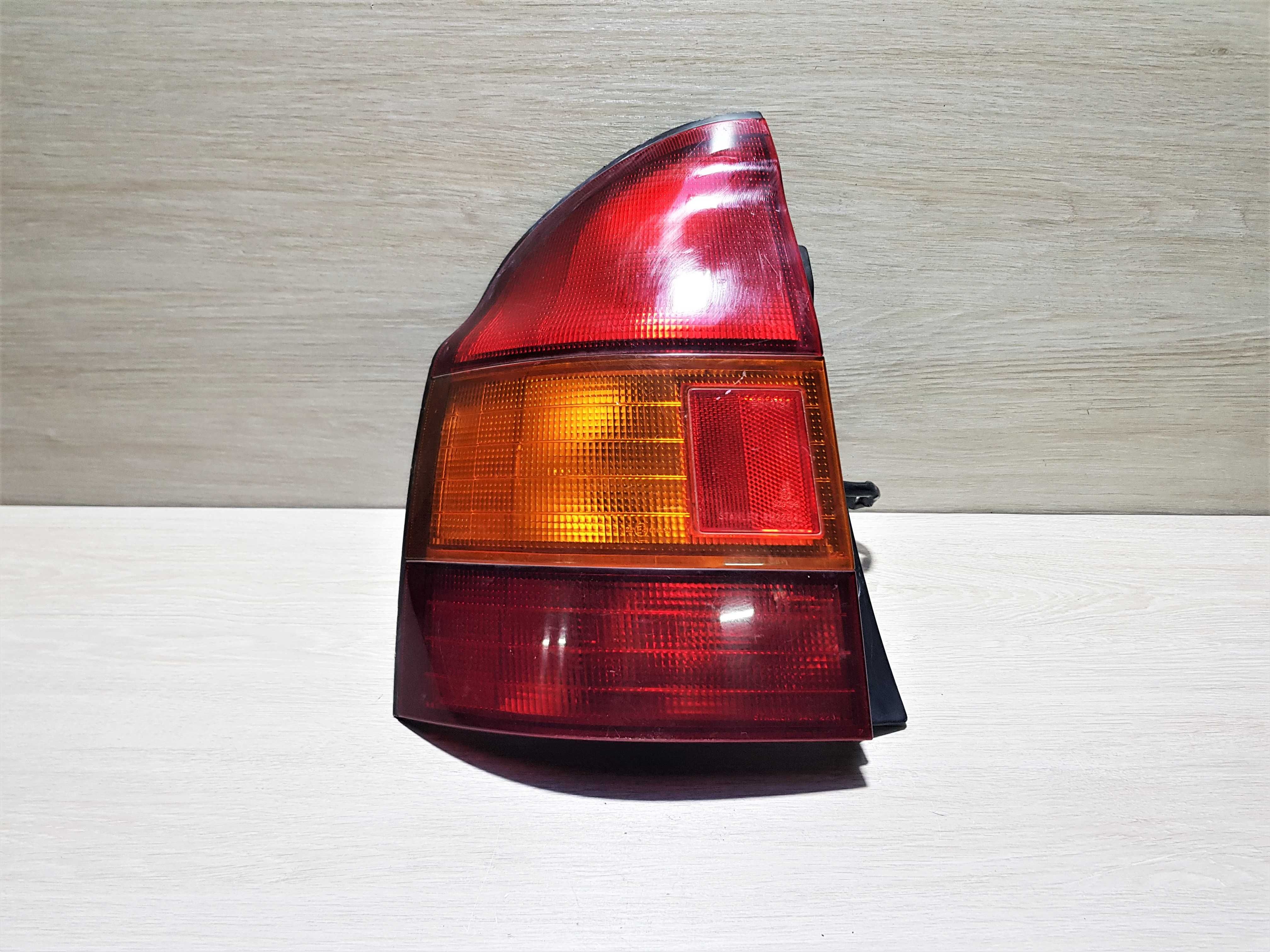 Ліхтар задній (стоп)лівий Mazda 323 P 1997-2000р.
