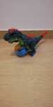 Dinossauro grande na cor preto e vermelho