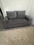 Sofa cama em tecido cinzento