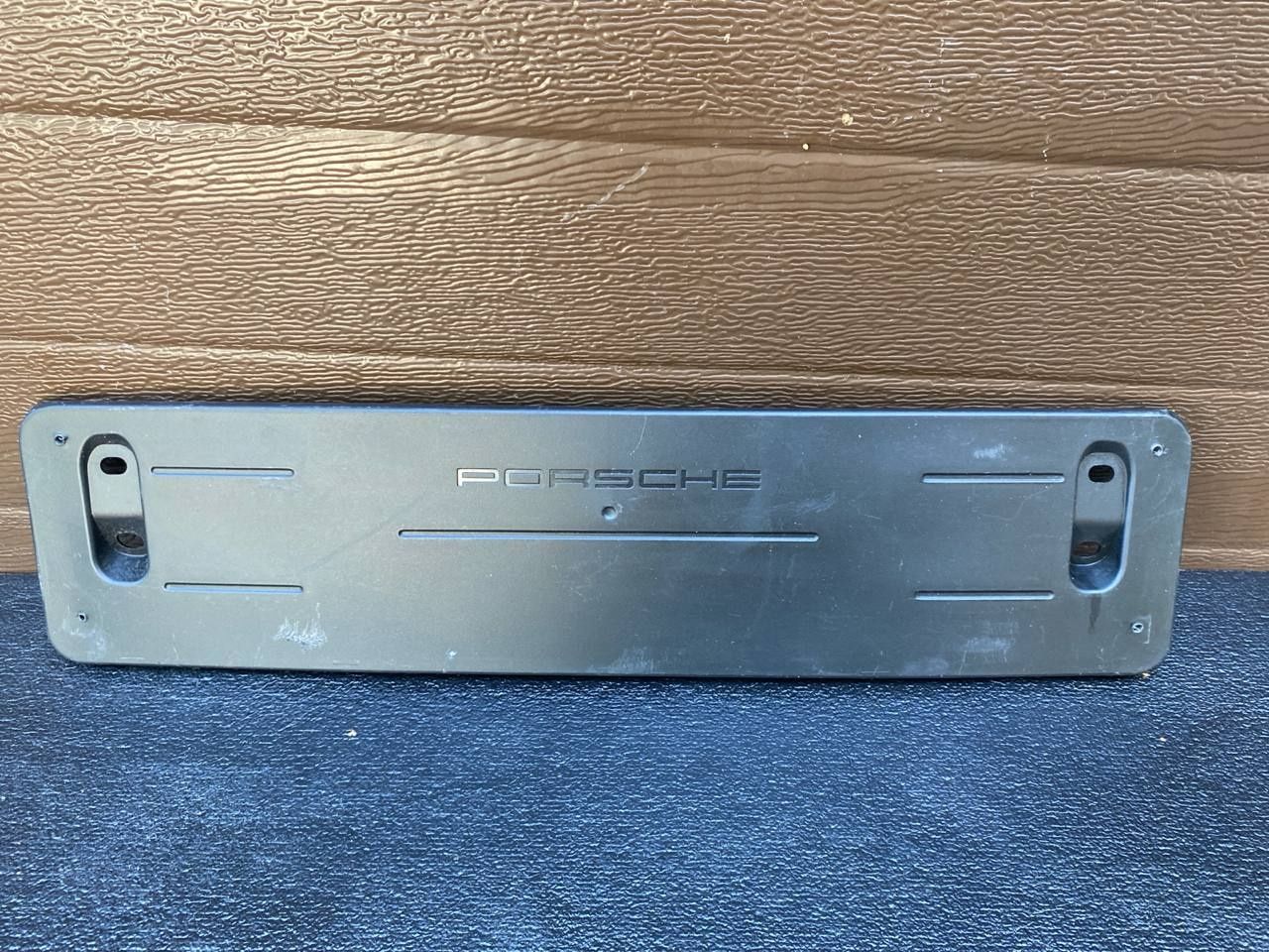 Porsche cayenne 9y подіум переднього номера 9y0807287ajok1