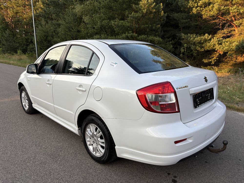 Suzuki sx4. Klimtronic biala perla