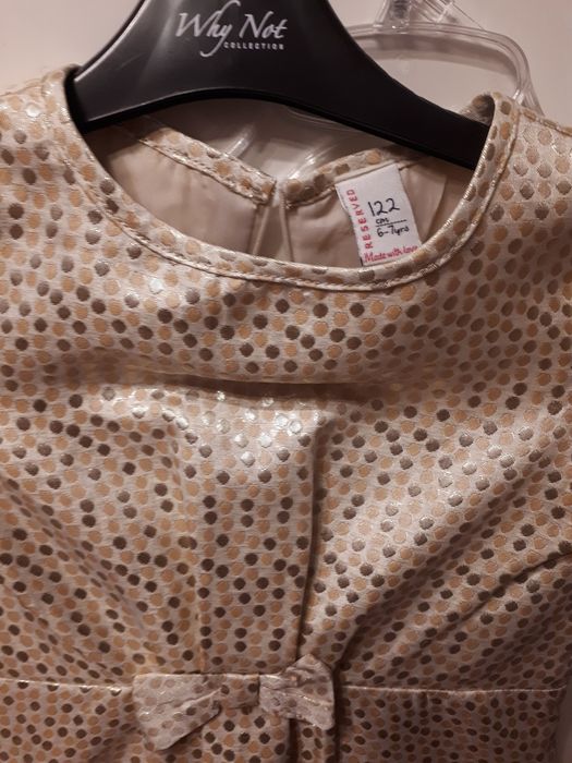 Złota sukienka Reserved jasna kremowa 122 nowa