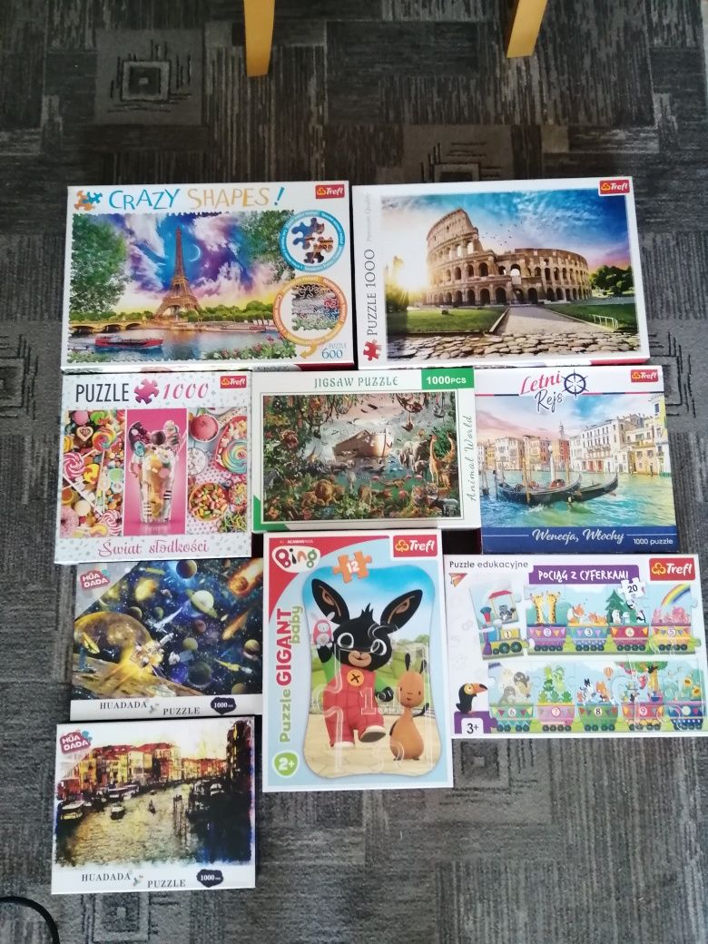 9 pudełek Puzzli od 12 do 1000 elementow