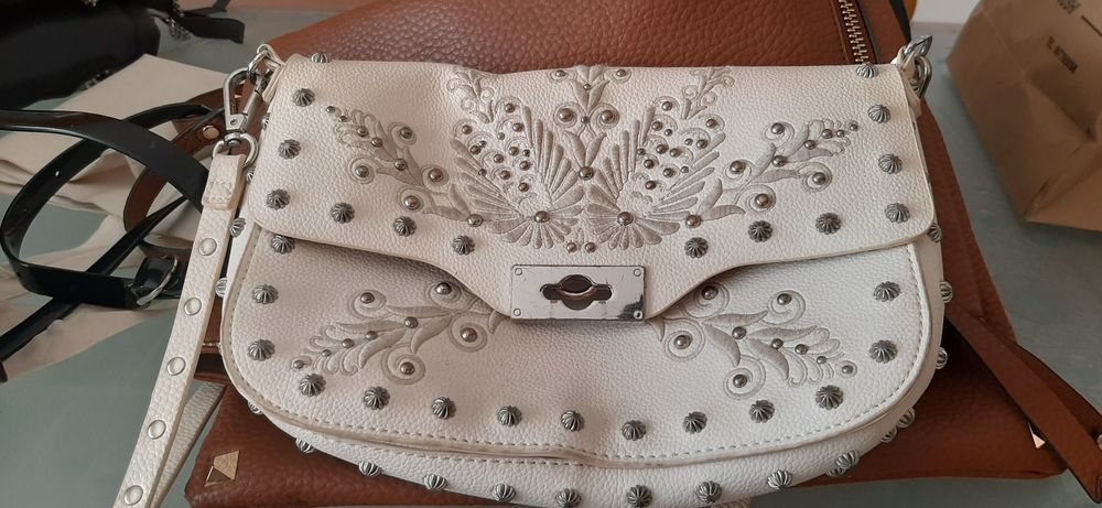 Carteiras e mochilas de marca original