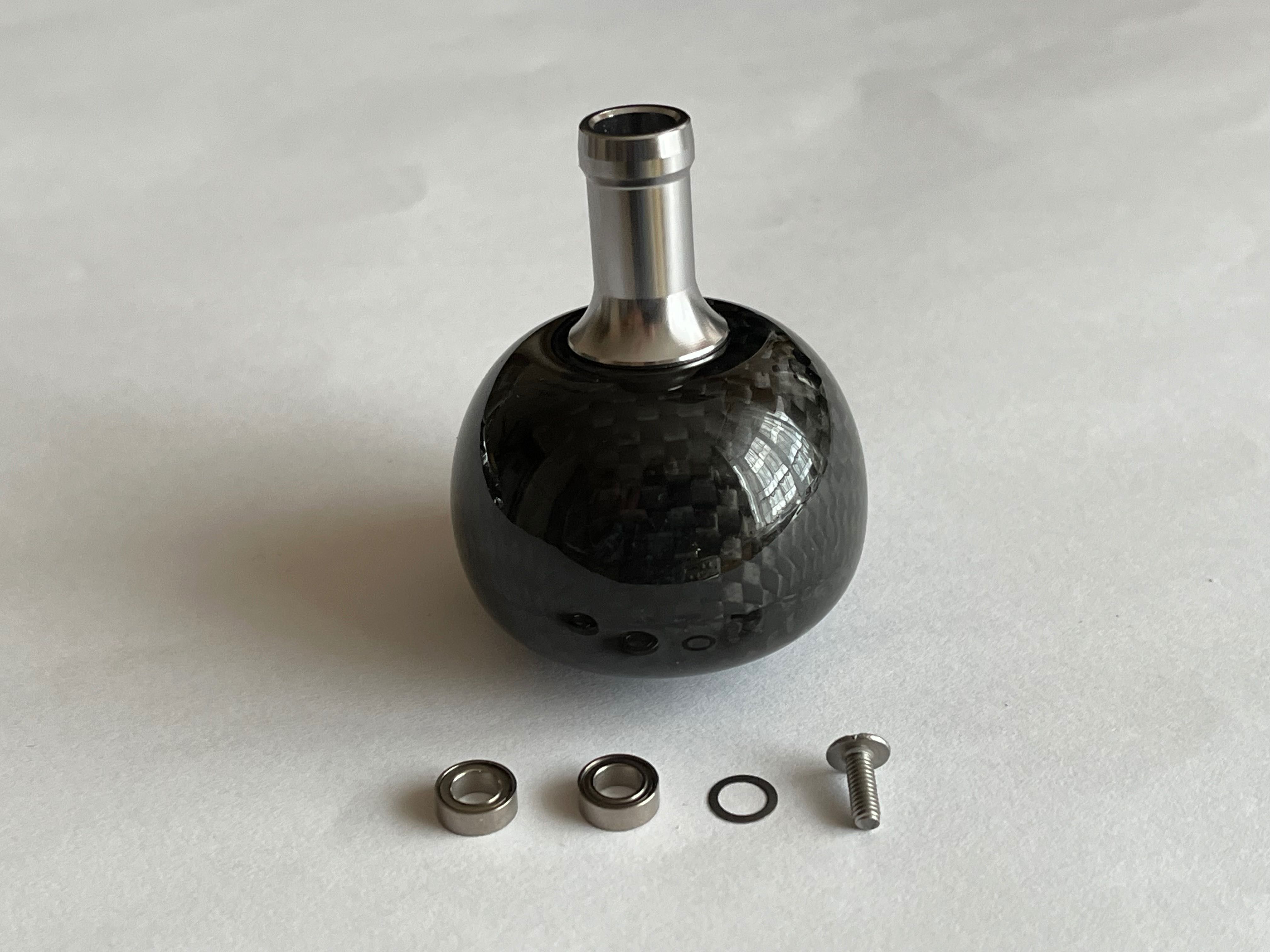 Knob tuningowy z włókna węglowego do kołowrotków Shimano, Daiwa
