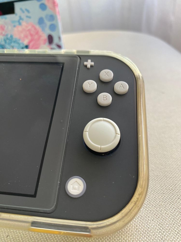 Nintendo switch lite + 3 jogos